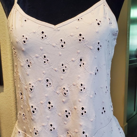 Hinge open eyelet peplum top - Picture 3 of 11
